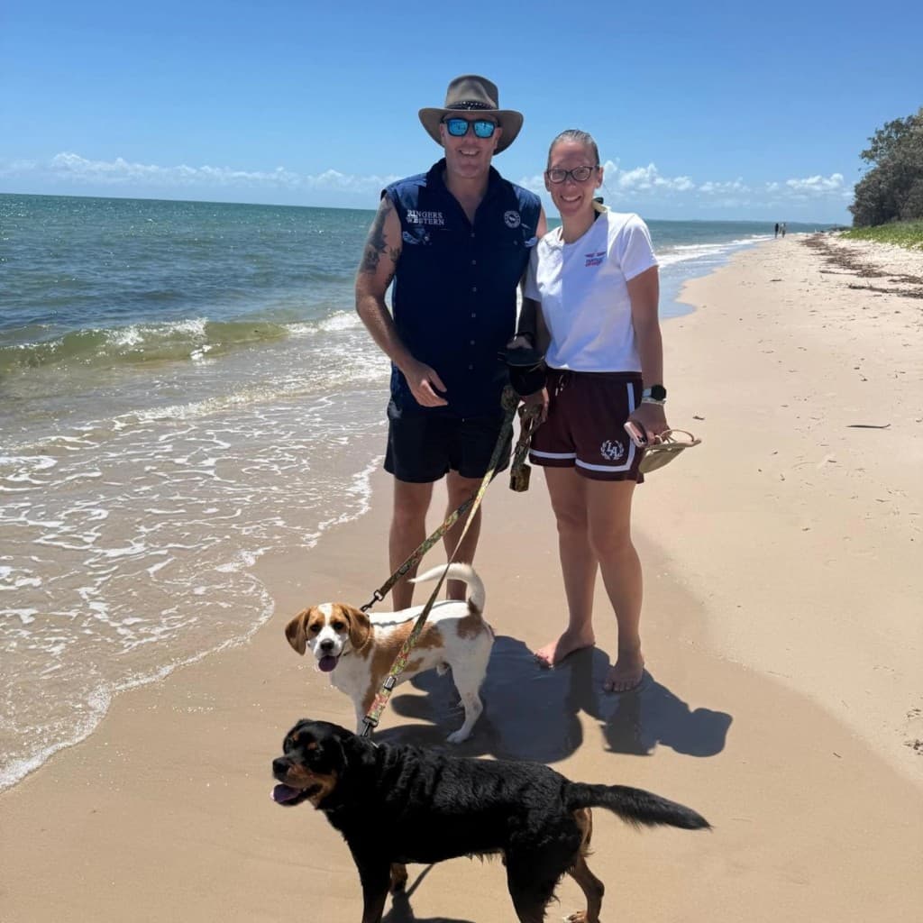 Ben and Joanne with their dogs Keith and Stuart on an Australian beach